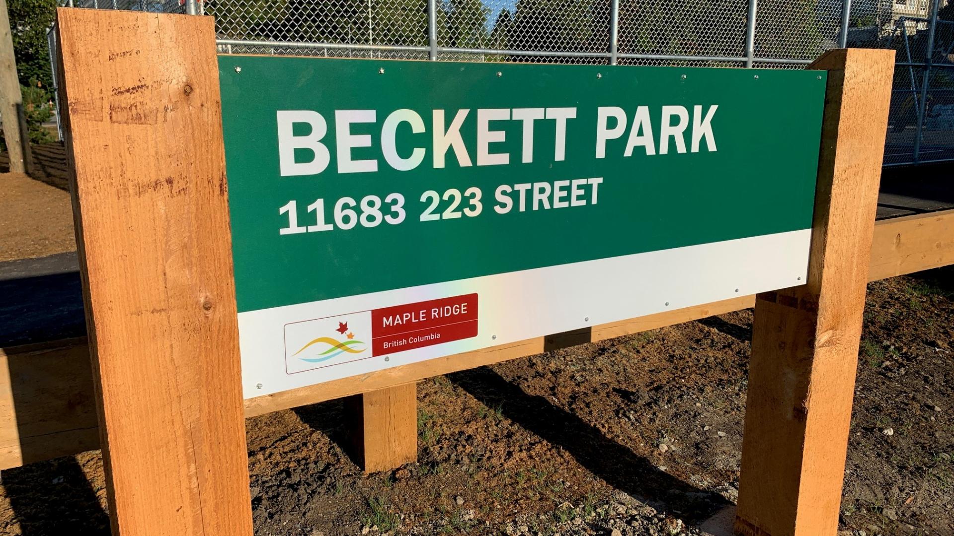 The Beckett Park sign. Its held up by fresh wooden posts. 